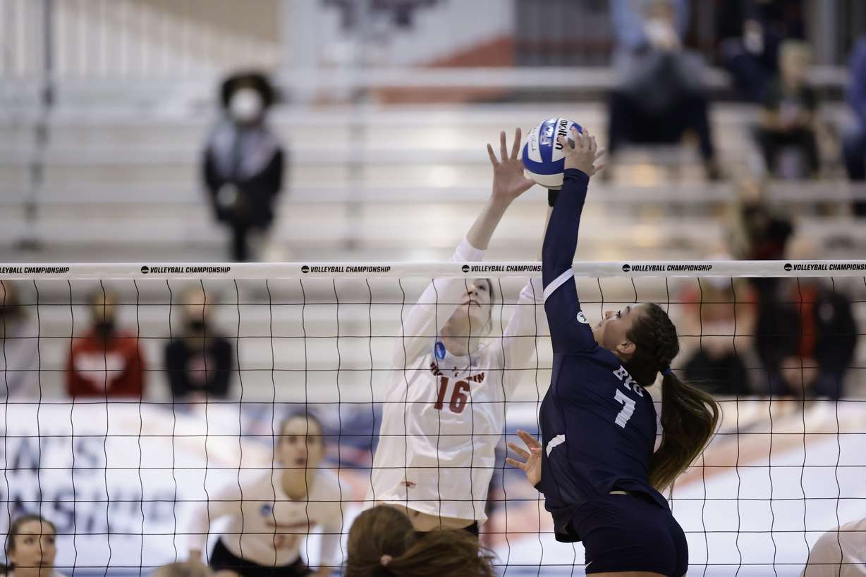 BYU setter Whitney Bower (7) tries to dump-kill a ball over the net during an NCAA Tournament match against Wisconsin, Saturday, April 17, 2021 in Omaha, Nebraska.