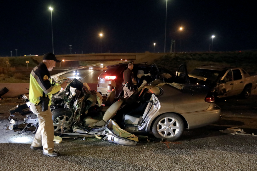 Utah Highway Patrol works at the scene of a wrong-way crash involving three vehicles in on the I-215 eastbound ramp from southbound I-15 in Murray on April 19, 2021.