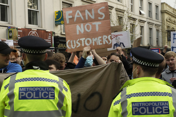 Chelsea fans protest outside Stamford Bridge stadium in London, against Chelsea's decision to be included amongst the clubs attempting to form a new European Super League, Tuesday, April 20, 2021. Reaction to the proposals from 12 clubs to rip up European soccer by forming a breakaway Super League has ranged from anger and condemnation to humor and sarcasm.