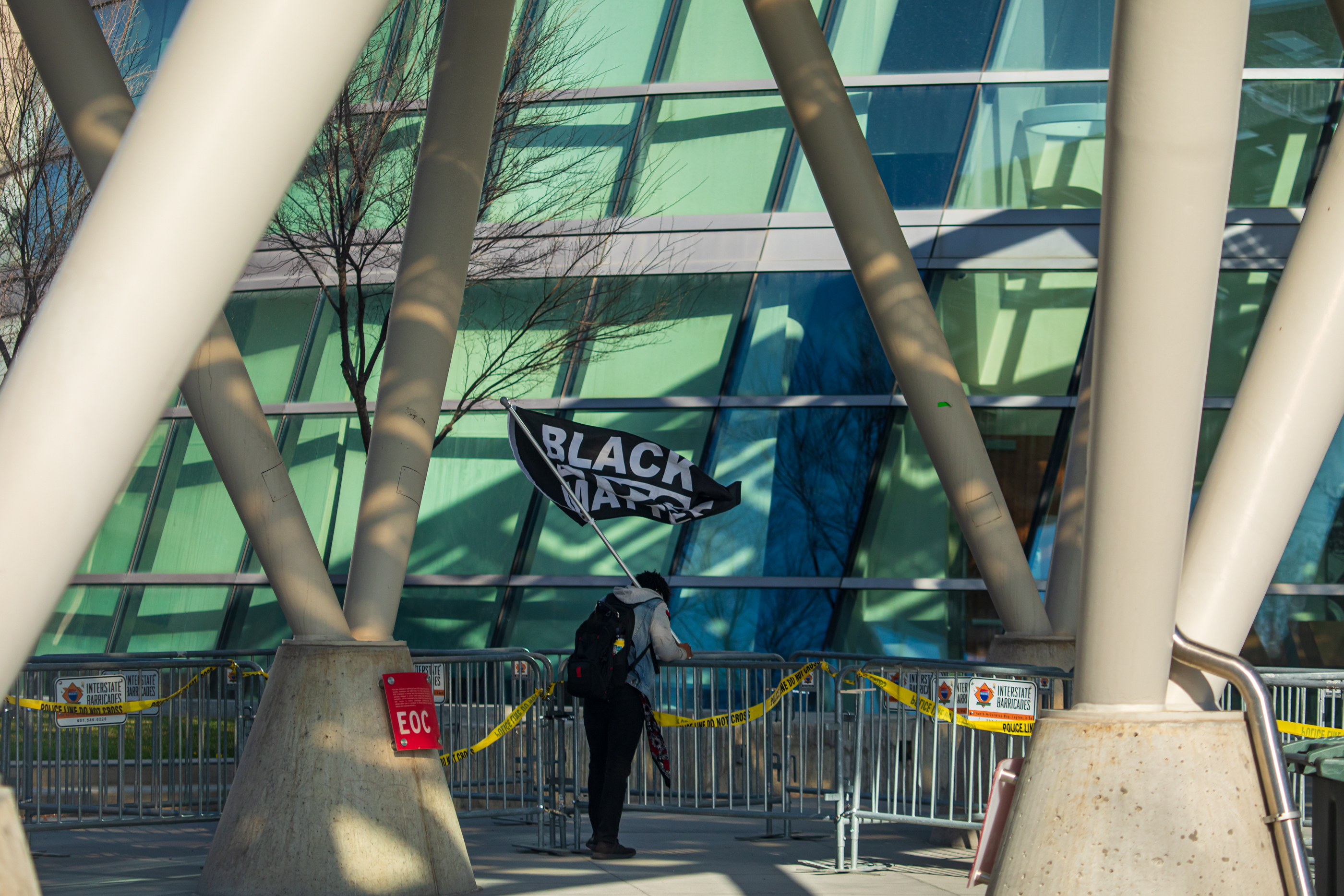 Tony Shade stands alone holding a Black Lives Matter flag outside of the Salt Lake City Public Safety Building after former Minneapolis police officer Derek Chauvin was convicted of murder in the death of George Floyd on Tuesday, April 20, 2021. Shade said he arrived an hour early to a rally following the conviction to show his support.