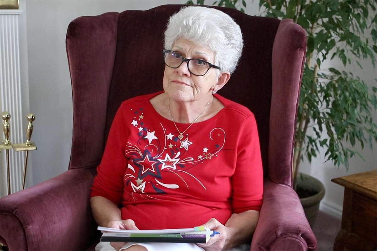 Former Davis County Attorney’s Office secretary Marily Gren holds a transcript of Joyce Yost’s preliminary hearing testimony during an interview for COLD on June 12, 2020.