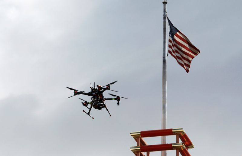 FILE PHOTO: A drone flies over downtown during a NASA demonstration on the testing of its Unmanned Aircraft Systems Traffic Management (UTM) platform in Reno, Nevada, U.S., May 21, 2019.  REUTERS/Bob Strong