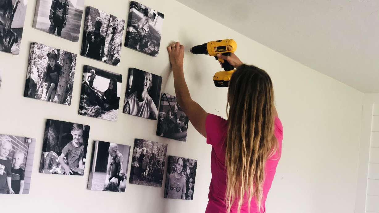 Arianne Brown works on hanging pictures during a home project gone awry.