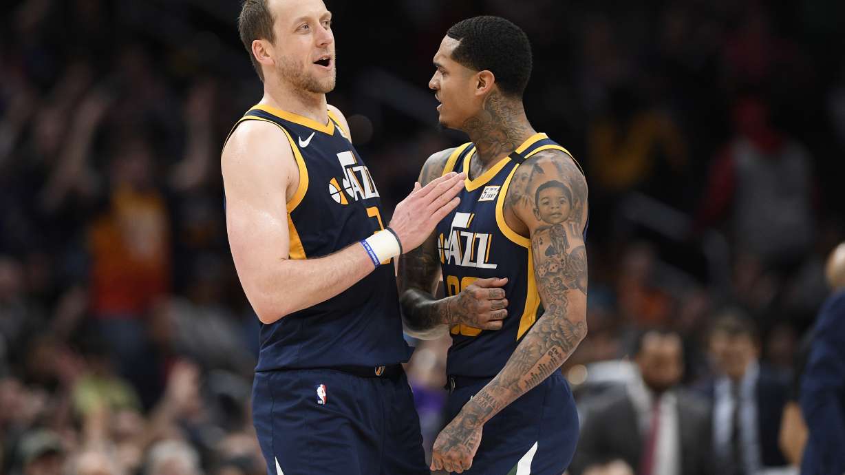Utah Jazz forward Joe Ingles (2) and guard Jordan Clarkson (00) react during the second half of an NBA basketball game against the Washington Wizards, Sunday, Jan. 12, 2020, in Washington. The Jazz won 127-116. (AP Photo/Nick Wass)