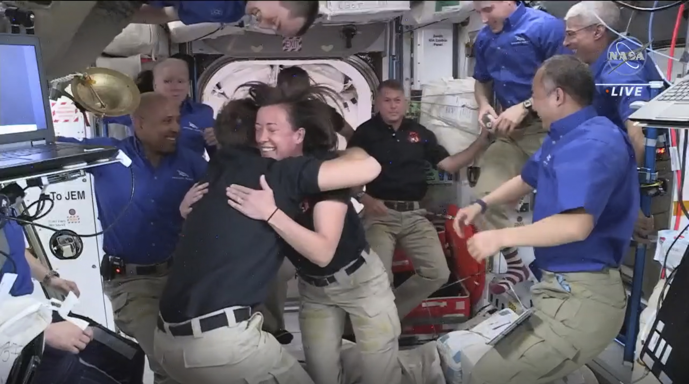 This image provided by NASA, astronauts from SpaceX are greeted by the astronauts from the International Space Station after the Dragon capsule successfully docked on Saturday, April 24, 2021. The recycled SpaceX capsule carrying four astronauts has arrived at the International Space Station, a day after launching from Florida.