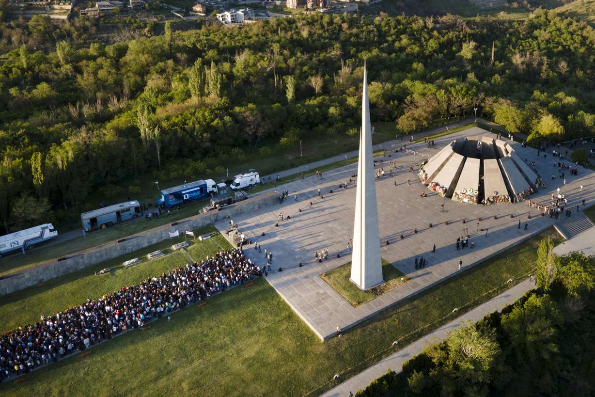 People lineup to lay flowers at the monument to the victims of mass killings by Ottoman Turks, to commemorate the 106th anniversary of the massacre, in Yerevan, Armenia, Saturday, April 24, 2021. Armenia's leader is praising President Joe Biden's recognition of the deaths of 1.5 million Armenians in Ottoman Turkey as genocide, calling it "a powerful step." Armenia marks the day as the anniversary of the 1915 rounding up of some 250 Armenian intellectuals, regarded as the first step in the killings that lasted until 1923.