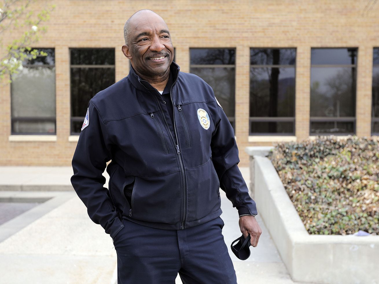 Murray Assistant Police Chief Joe Tarver poses for a
portrait outside of Murray City Hall in Murray on Tuesday, April
13, 2021. Tarver is leaving the department to become chief of
investigations for the Salt Lake County District Attorney’s Office.