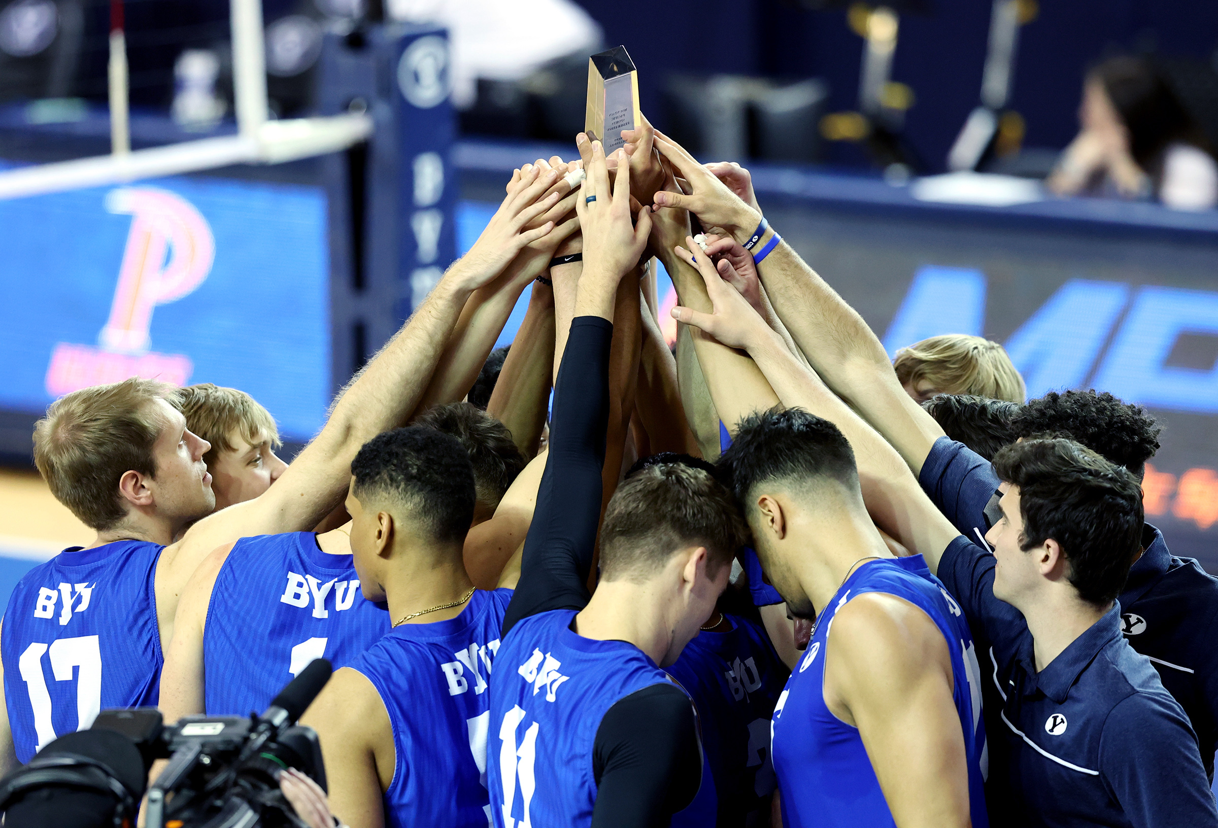 BYU players hold up the winning trophy after defeating Pepperdine in the finals of the Mountain Pacific Sports Federation Championship, at the Smith Field House in Provo on Saturday, April 24, 2021. BYU won in straight sets.