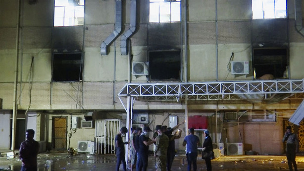 In this image made from video, first responders work the scene of a fire at a hospital in Baghdad on Saturday, April 24, 2021.