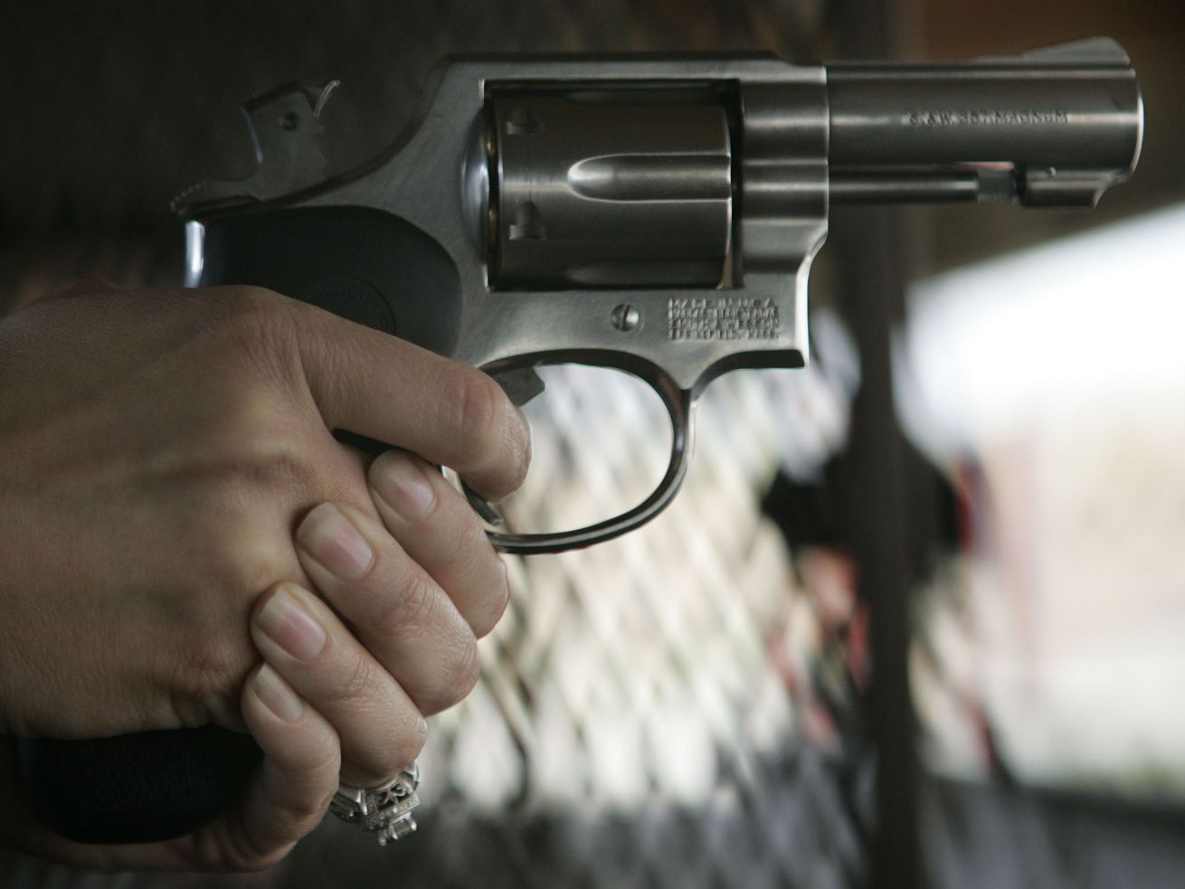A student holds a gun during a conceal and carry
weapons certification for members of the media at Lee Kay Shooting
Range in Salt Lake City May 31, 2009.