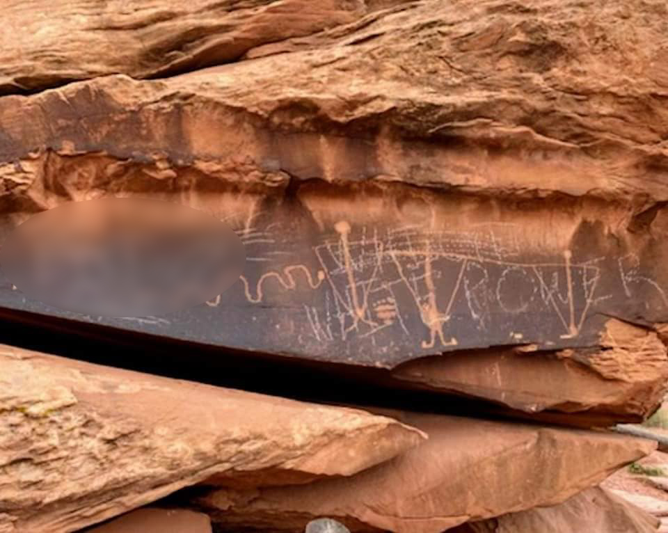 A blurred-out image of vandalism to Birthing Rock in Grand County, which was reported to federal officials on April 26, 2021. The incident near Moab was one of the state's larger petroglyph vandalism cases in recent history.