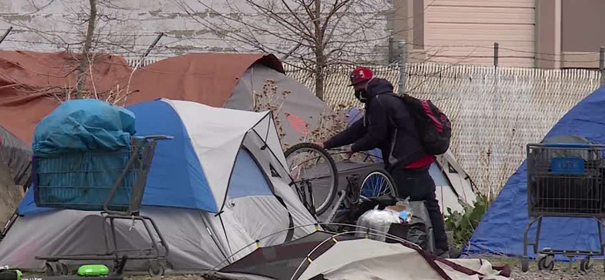 A property owner calls on city and state leaders, and police, to close a homeless camp near 500 West and 900 South in Salt Lake City Tuesday, April 27, 2021.