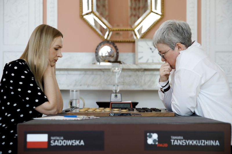 Draught players Polish Natalia Sadowska and Russian Tamara Tansykkuzhina play a game during the Women's World Draughts Championship in Warsaw, Poland April 28, 2021. REUTERS/Kacper Pempel