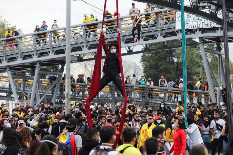 A woman performs an aerial dance during a protest against the tax reform of President Ivan Duque's government in Bogota, Colombia April 28, 2021. REUTERS/Luisa Gonzalez