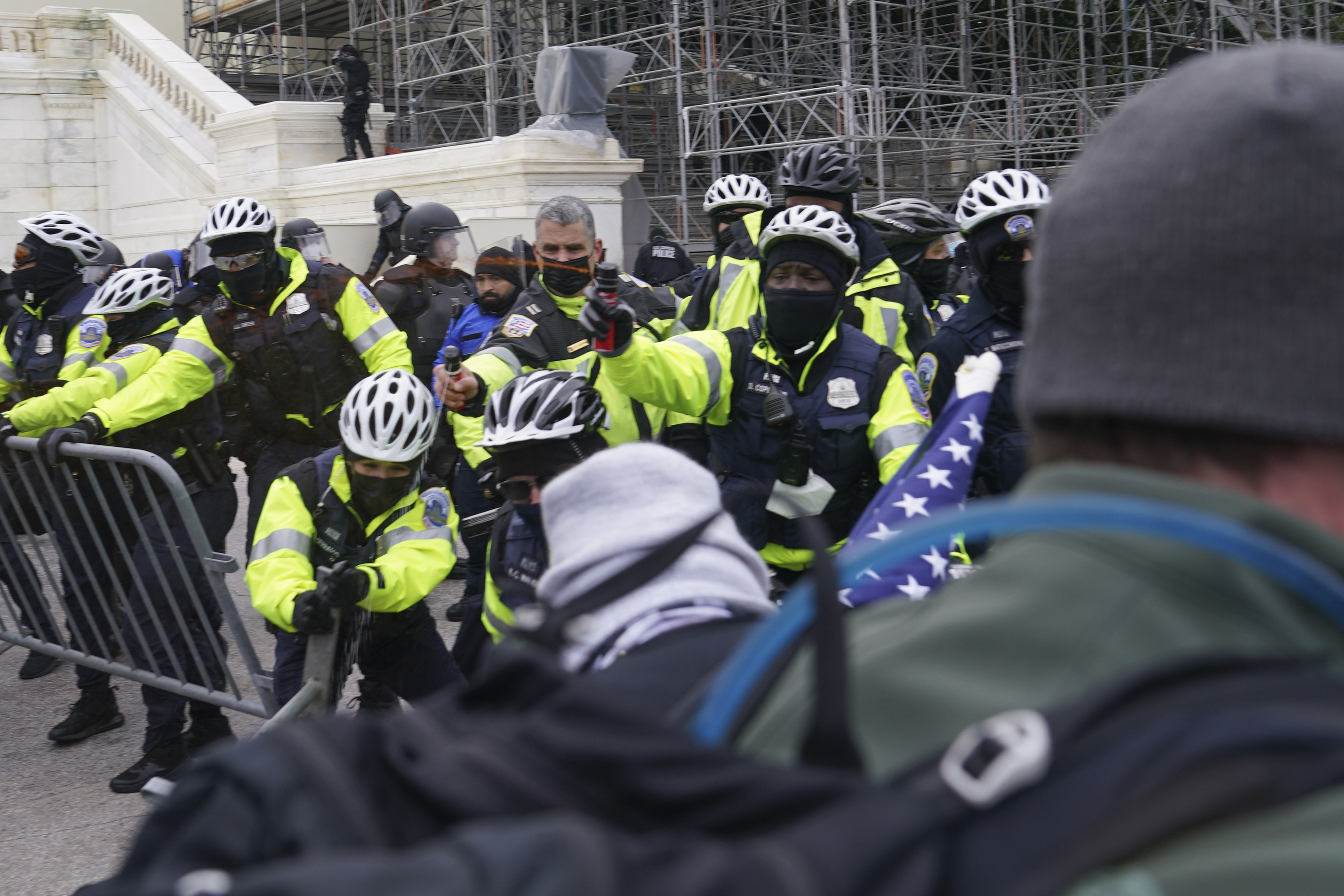 In this Wednesday, Jan. 6, 2021, photo, violent rioters try to break through a police line on the West Front of the Capitol, in Washington. The top watchdog for the U.S. Capitol Police will testify to Congress for the first time about the department’s broad failures before and during the Jan. 6 insurrection. Among them was missed intelligence and old weapons that officers didn’t feel comfortable using. (AP Photo/John Minchillo) [Apr-28-2021]