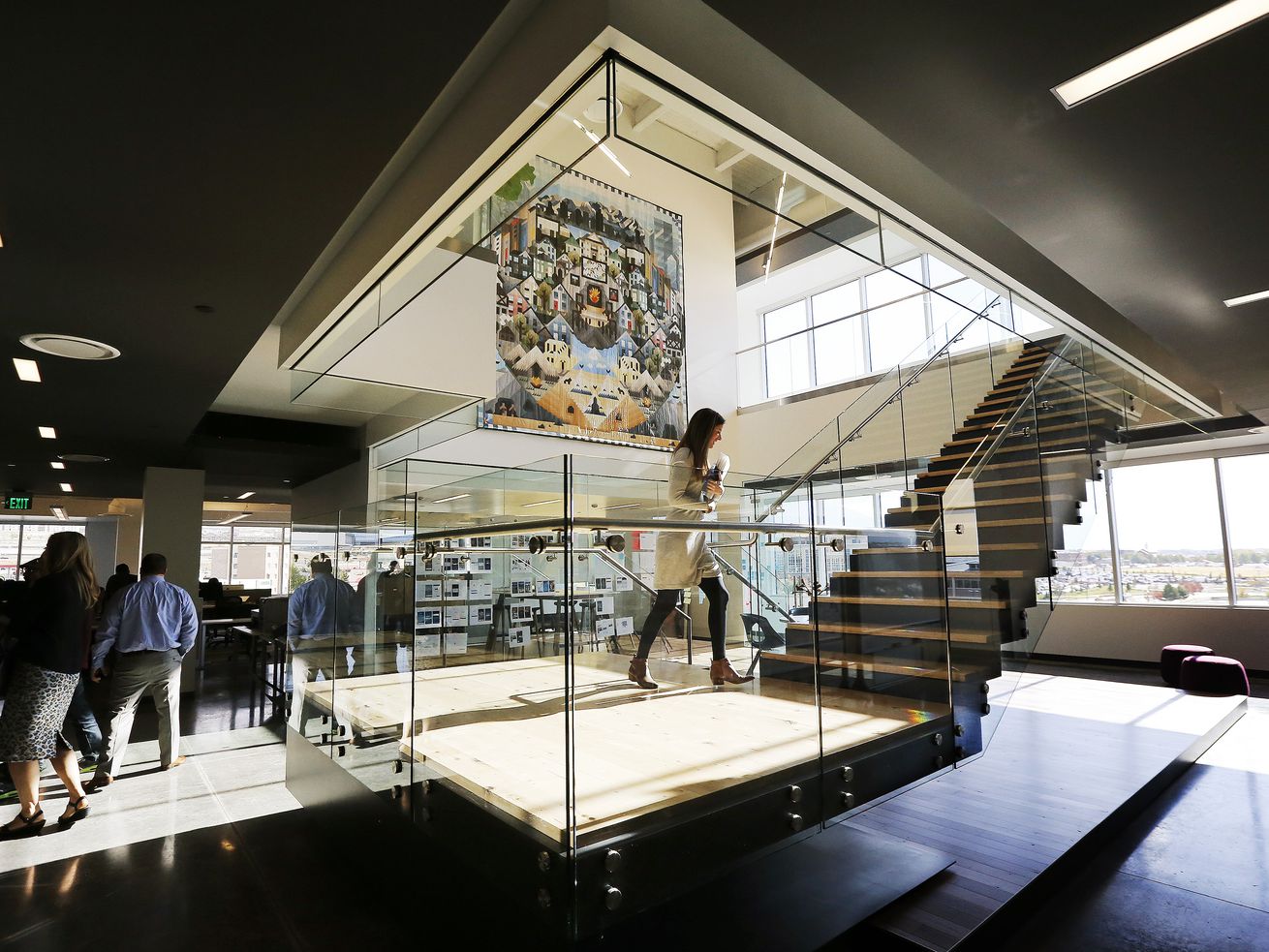 Employees walk through the building during Vivint’s
Innovation Center grand opening in Lehi on Oct. 21, 2014. On
Thursday, the Federal Trade Commission announced it had reached a
$20 million agreement with Vivint Smart Home over abuses of
customer credit information.