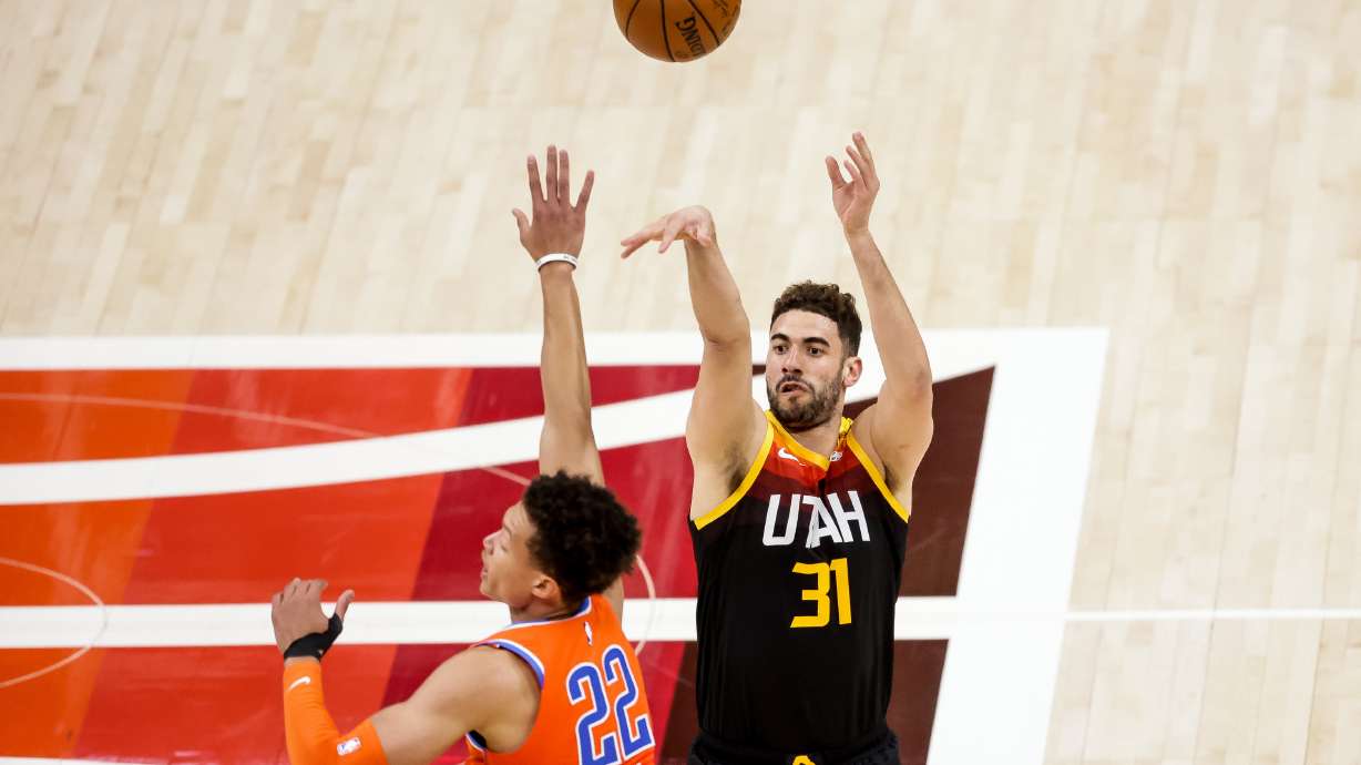 Utah Jazz forward Georges Niang (31) shoots over Oklahoma City Thunder center Isaiah Roby (22) during the game at Vivint Smart Home Arena in Salt Lake City on Tuesday, April 13, 2021.