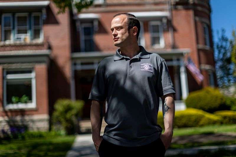 Jesse Goertzen poses for a photo outside of The Other
Side Academy in Salt Lake City on Thursday, April 29, 2021. The
nonprofit organization has been tapped by the city to operate a
planned tiny home community to house homeless people.