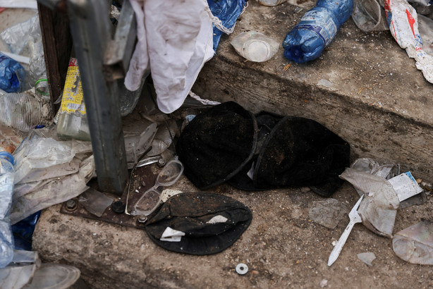 Black yarmulkas are seen on stairs with other waste on it as well in Mount Meron, northern Israel, where fatalities were reported among the thousands of ultra-Orthodox Jews gathered at the tomb of a 2nd-century sage for annual commemorations that include all-night prayer and dance, April 30, 2021. Reuters, Ronen Zvulun