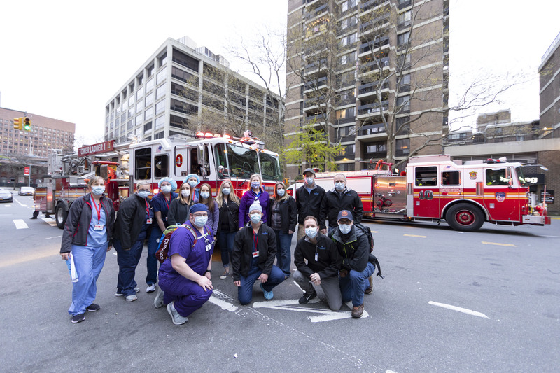 This undated photo shows Intermountain Healthcare workers posing in front of fire trucks in New York City during the early COVID-19 pandemic.