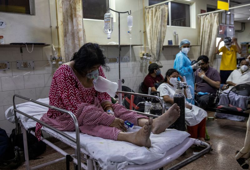 A patient suffering from the coronavirus disease receives treatment inside the casualty ward at a hospital in New Delhi, India, May 1, 2021.