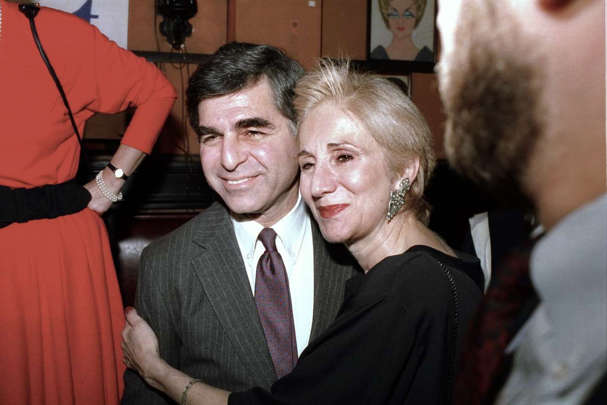 FILE - In this Feb. 23, 1988 file photo, Massachusetts Gov. Michael Dukakis poses with cousin Olympia Dukakis during fundraiser in New York.