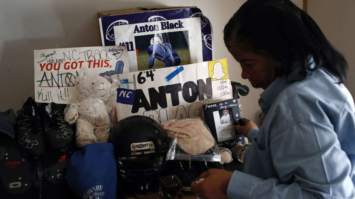 FILE - In this Jan. 28, 2019 file photo, Jennell Black, mother of Anton Black, looks at a collection of her son's belongings at her home in Greensboro, Md. Anton Black, 19, died after a struggle with three officers and a civilian outside the home in September 2018. Cases involving police use of force often include questions about the internal records of the officers involved, records that in most cases are off-limits to the press and public. Lawmakers in at least 13 states have considered bills this year to make those records more publicly available. (AP Photo/Patrick Semansky, File)