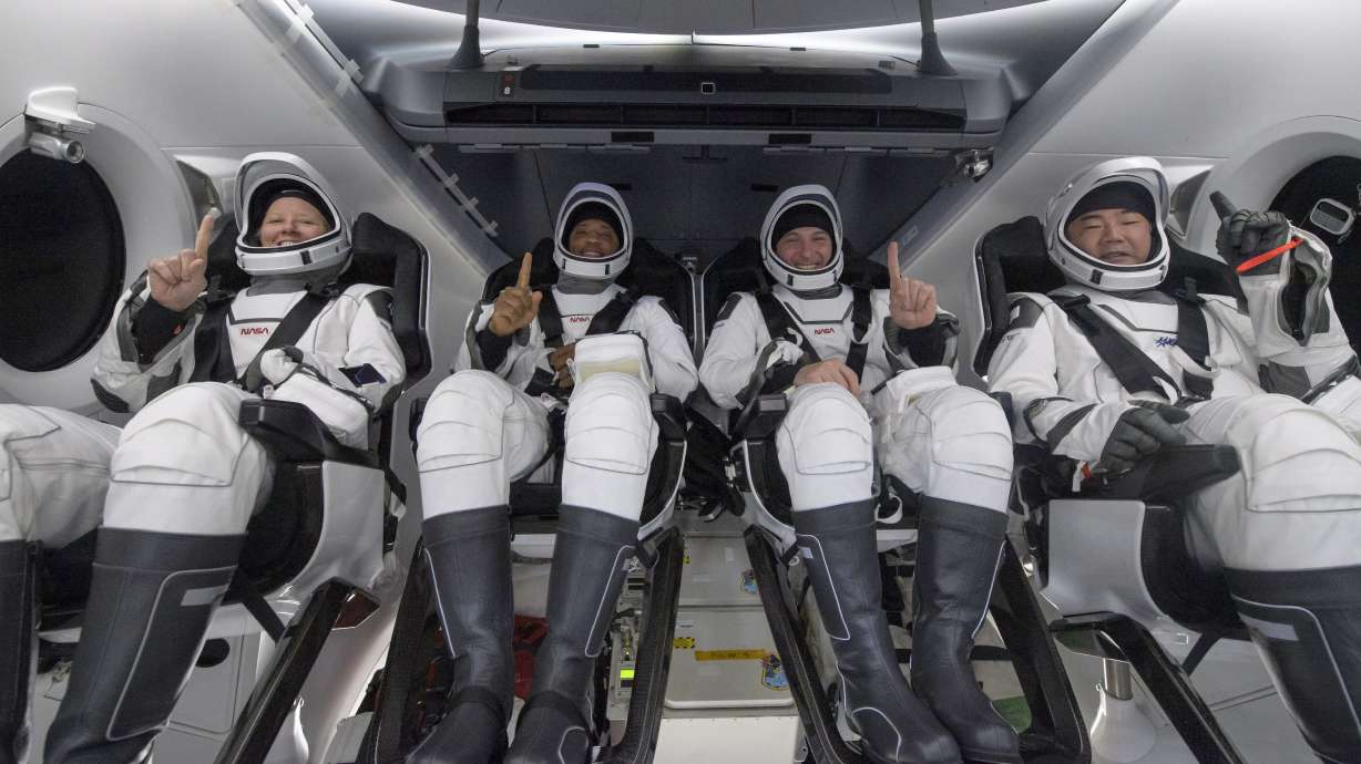 NASA astronauts Shannon Walker, left, Victor Glover, Mike Hopkins, and Japan Aerospace Exploration Agency (JAXA) astronaut Soichi Noguchi, right are seen inside the SpaceX Crew Dragon Resilience spacecraft onboard the SpaceX GO Navigator recovery ship shortly after having landed in the Gulf of Mexico off the coast of Panama City, Florida, Sunday, May 2, 2021. NASA's SpaceX Crew-1 mission was the first crew rotation flight of the SpaceX Crew Dragon spacecraft and Falcon 9 rocket with astronauts to the International Space Station as part of the agency's Commercial Crew Program. (Bill Ingalls/NASA via AP)