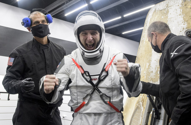 NASA astronaut Mike Hopkins is helped out of the SpaceX Crew Dragon Resilience spacecraft onboard the SpaceX GO Navigator recovery ship after he, NASA astronauts Mike Hopkins, Shannon Walker, and Japan Aerospace Exploration Agency (JAXA) astronaut Soichi Noguchi, landed in the Gulf of Mexico off the coast of Panama City, Florida, Sunday, May 2, 2021. NASA's SpaceX Crew-1 mission was the first crew rotation flight of the SpaceX Crew Dragon spacecraft and Falcon 9 rocket with astronauts to the International Space Station as part of the agency's Commercial Crew Program.