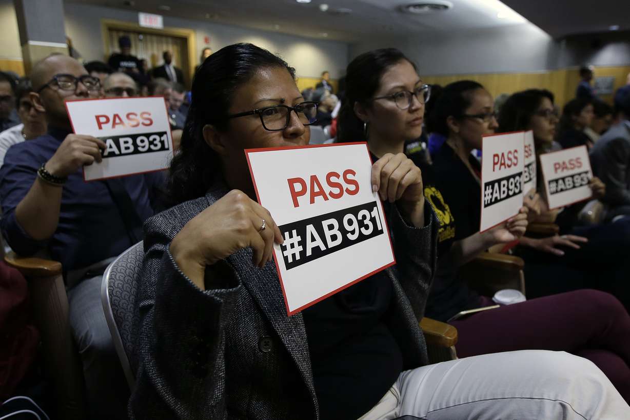 In this June 19, 2018 file photo, Rosa Cabrera, foreground, joined others in support of a measure to limit police use of deadly force, during a hearing of the Senate Public Safety Committee in Sacramento, Calif. Cases involving police use of force often include questions about the internal records of the officers involved, records that in most cases are off-limits to the press and public. Lawmakers in at least 13 states have considered bills this year to make those records more publicly available.