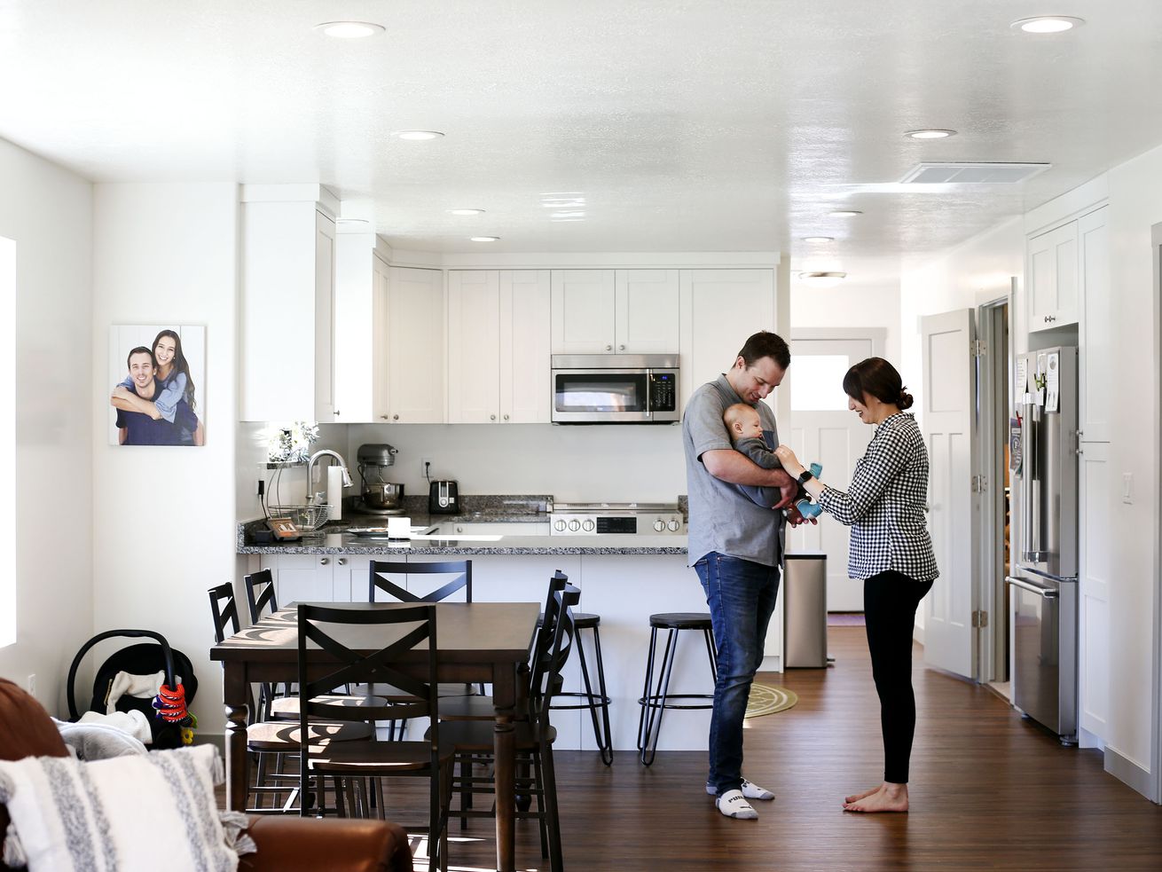Mark, left, and Missy Haslam play with their son,
Maverick, in their net-zero home in Ogden on Wednesday, April 27,
2021. The Weber State University-driven project took first place
internationally for its energy performance in a fierce competition,
beating out eight other teams.