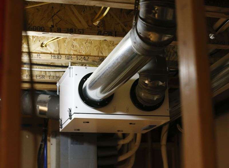 An energy recovery ventilation system is pictured in
the Weber State University-driven net-zero home in Ogden on
Wednesday, April 27, 2021. The system continuously exchanges stale
air with fresh outside air and recovers 95% of the energy invested
in that air. The home took first place internationally for its
energy performance in a fierce competition, beating out eight other
teams.