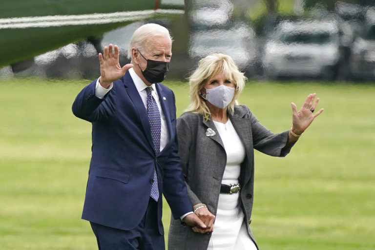 President Joe Biden and first lady Jill Biden wave after stepping off Marine One on the Ellipse near the White House, Monday, May 3, 2021, in Washington. The Biden's traveled Monday to coastal Virginia to promote his plans to increase spending on education and children, part of his $1.8 trillion families proposal announced last week.