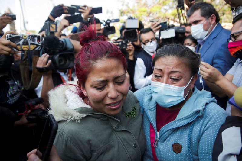 Relatives arrive looking for Brandon Giovani Hernandez Tapia, near the site where an overpass for a metro partially collapsed with train cars on it at Olivos station in Mexico City, Mexico May 4, 2021.