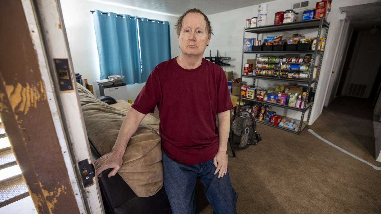 Roderick Boyd poses for photos inside his West Jordan apartment on Monday, May 3, 2021. Boyd said he was victimized by a scammer who claimed to be a wealthy donor who would pay off his debts. Boyd said the scammer asked him to send gift cards for children in return. After Boyd sent the gift cards, he said the scammer's payment was canceled, leaving him out of hundreds of dollars.