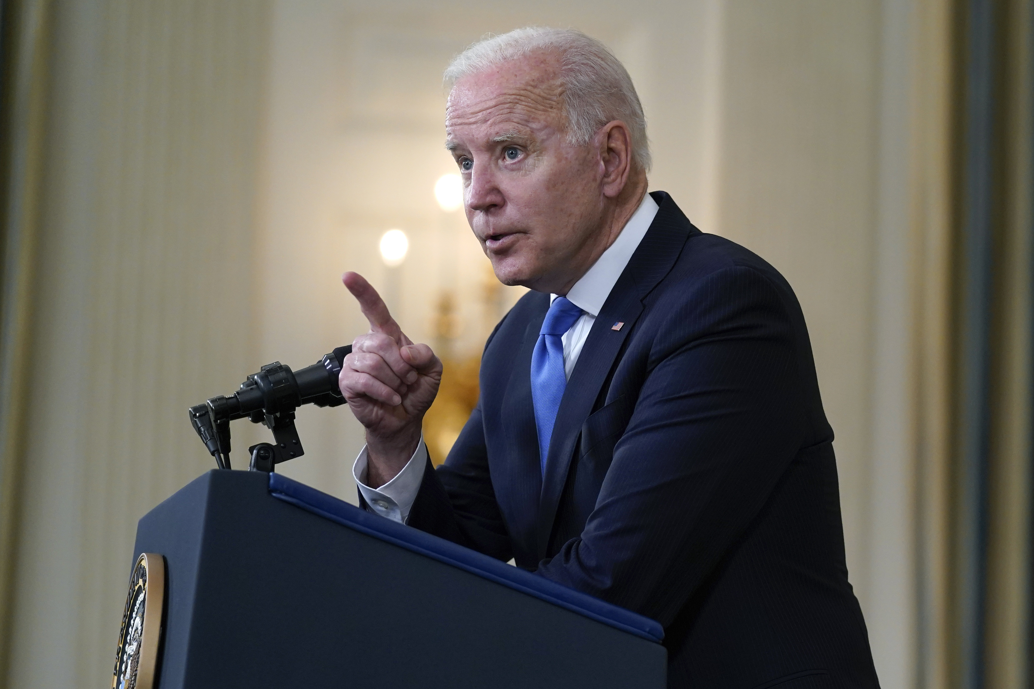 President Joe Biden takes questions from reporters as he speaks about the American Rescue Plan, in the State Dining Room of the White House, Wednesday, May 5, 2021, in Washington. 