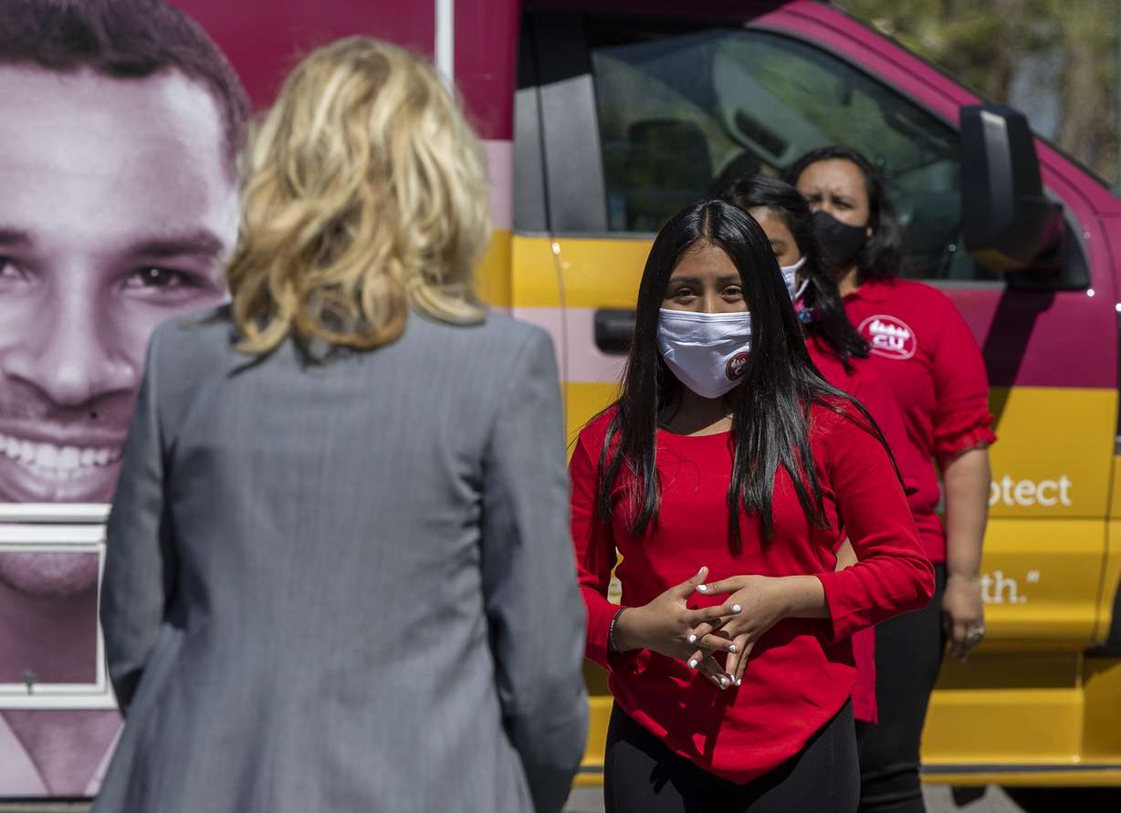 Lesley Soldad, right, a youth organizer from Comunidades Unidas, a nonprofit serving Utah's Latinos, talks to first lady Jill Biden as she pays a visit to a COVID-19 vaccination pop-up clinic at Jordan Park in Salt Lake City on Wednesday, May 5, 2021.
