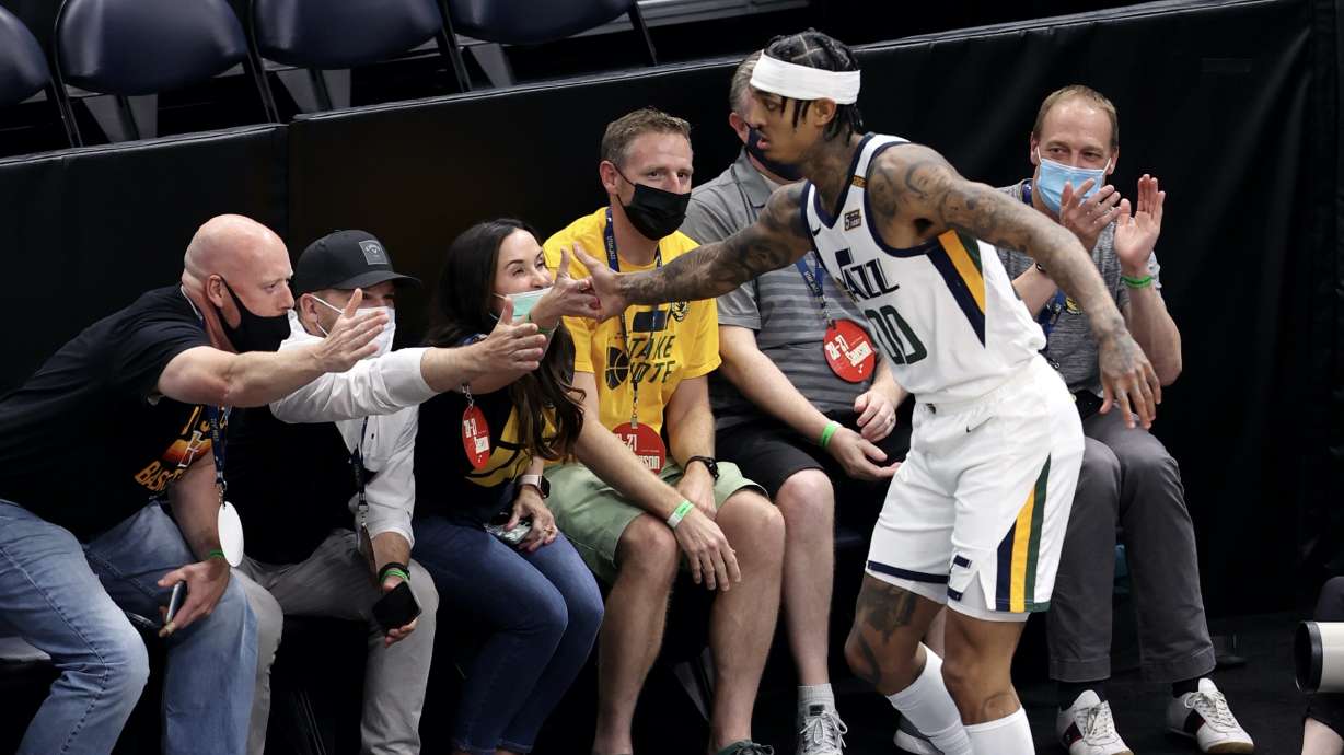 Utah Jazz guard Jordan Clarkson (00) celebrates with fans after a basket as the Utah Jazz and the San Antonio Spurs play an NBA basketball game at Vivint Arena in Salt Lake City on Wednesday, May 5, 2021. Utah won 126-94.