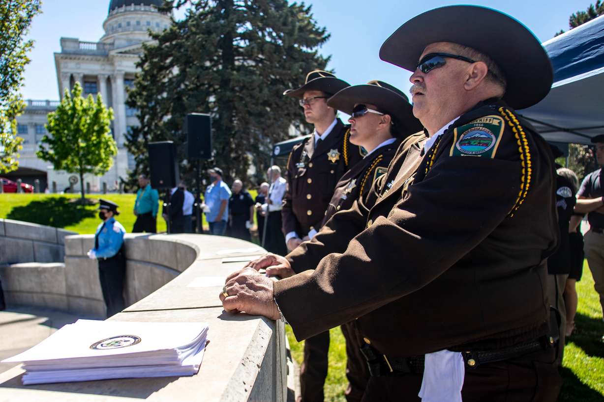 Law enforcement officers with the Box Elder County Sheriff's Office listen during the annual Utah Police Memorial Service at the Utah Capitol on Thursday, May 6, 2021. Utah police officers, family, friends and community leaders gathered for the annual service honoring the 147 Utah police officers killed in the line of duty.