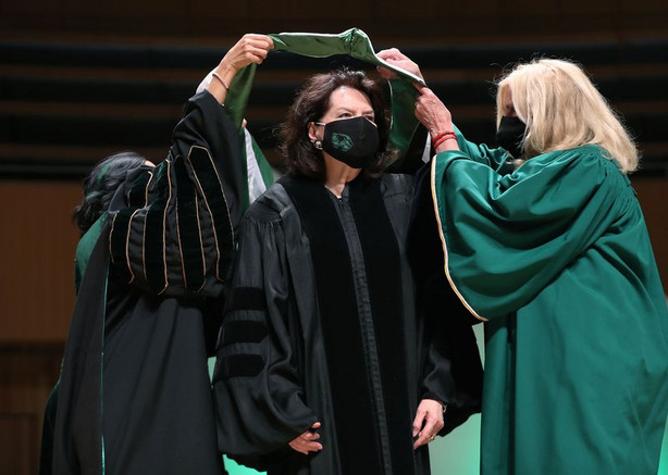 Sister Wendy Nelson receives her honorary degree from
UVU President Astrid Tuminez and UVU board of trustees member Elaine
Dalton at Utah Valley University’s graduation in Orem on Friday,
May 7, 2021.