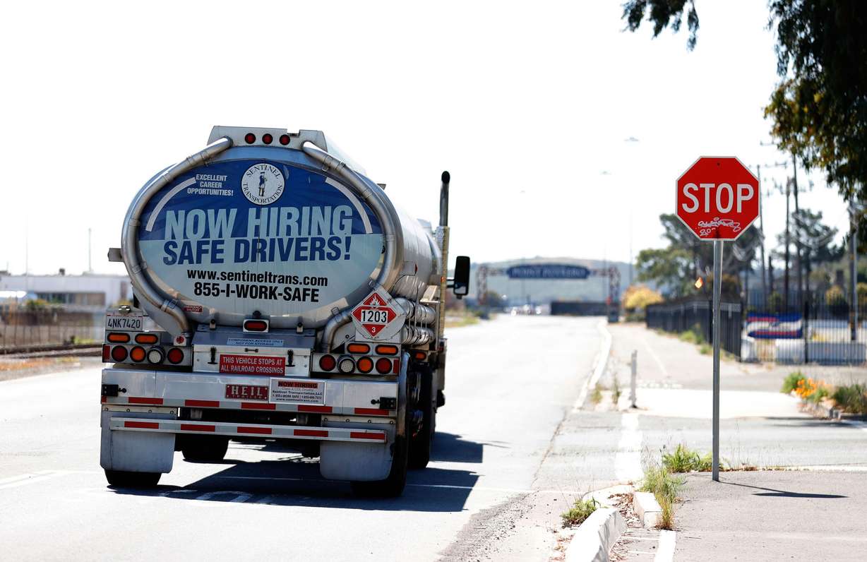 A now hiring advertisement appears on the back of a fuel trucks on April 29, 2021 in Richmond, California.
