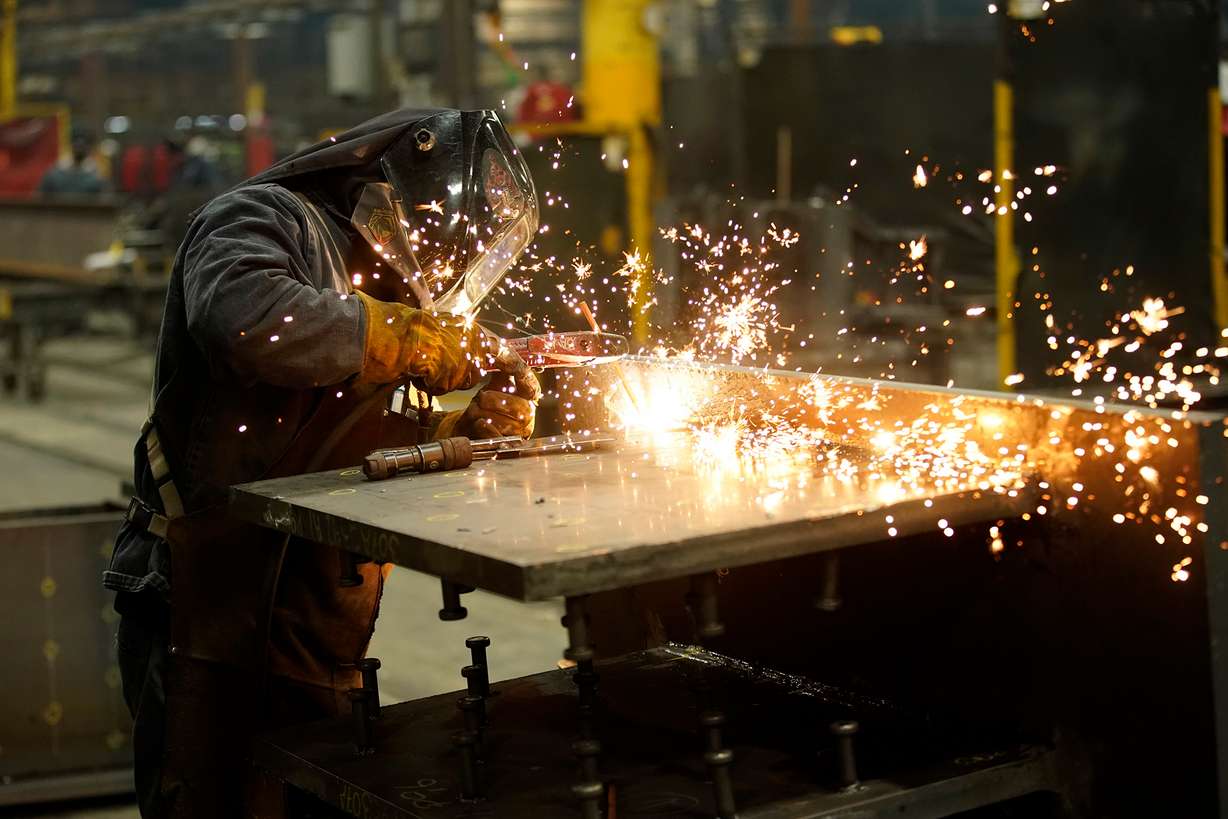 A worker welds a structural steel beam during production at the SME Steel Contractors facility in West Jordan, Utah, U.S., on Feb. 1, 2021.