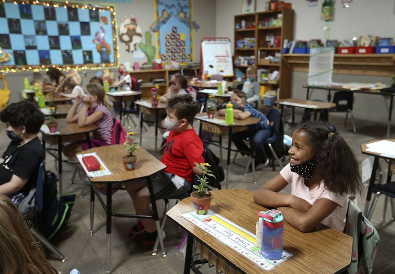 India Boyé, right, sits in class at Willow Canyon
Elementary School in Sandy on Thursday, May 6, 2021. India won a
national PTA Reflections award for her original rap about being
biracial.