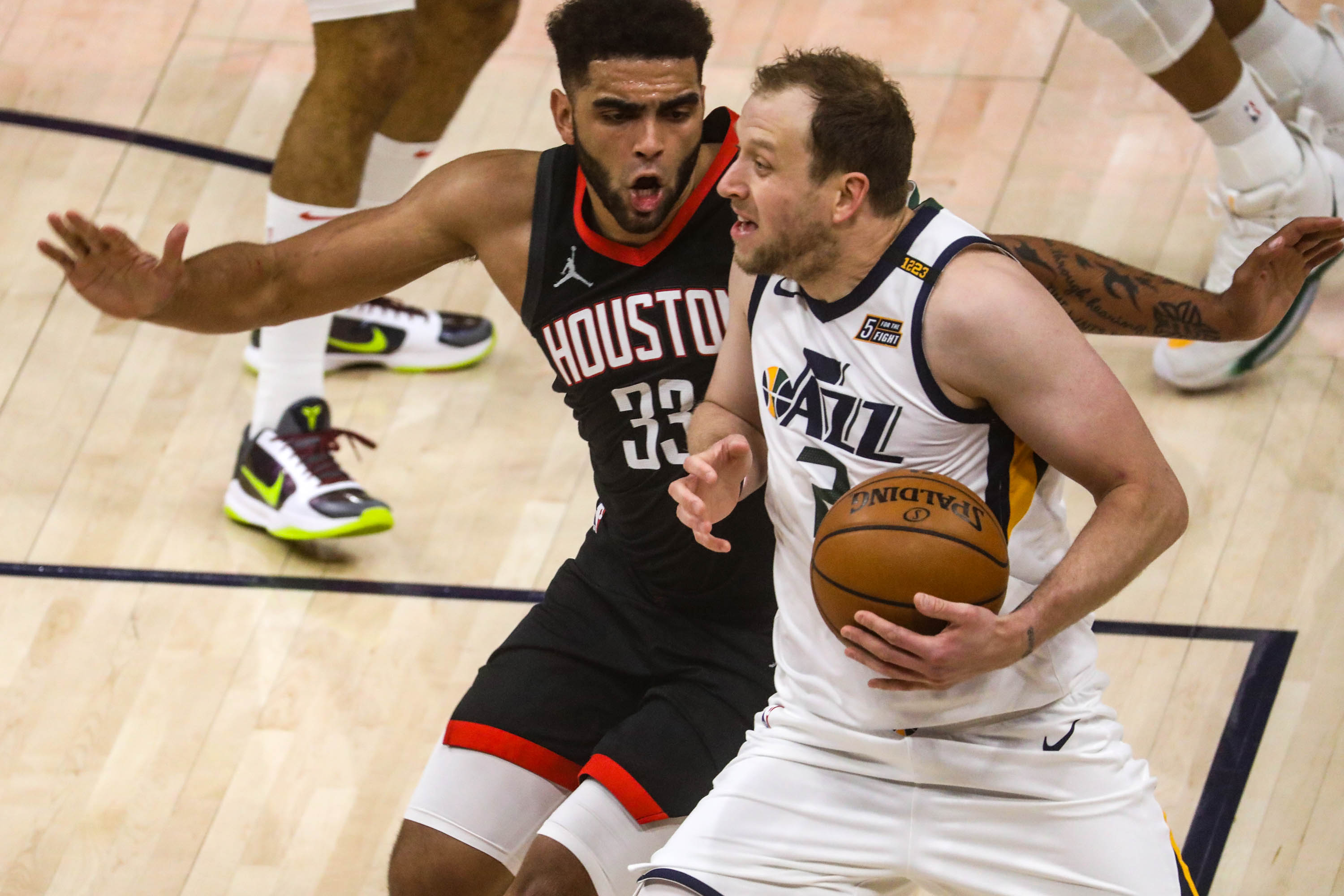 Utah Jazz guard Joe Ingles (2) moves around Houston Rockets forward Anthony Lamb (33) as the Utah Jazz and the Houston Rockets play an NBA basketball game at Vivint Arena in Salt Lake City on Saturday, May 8, 2021.