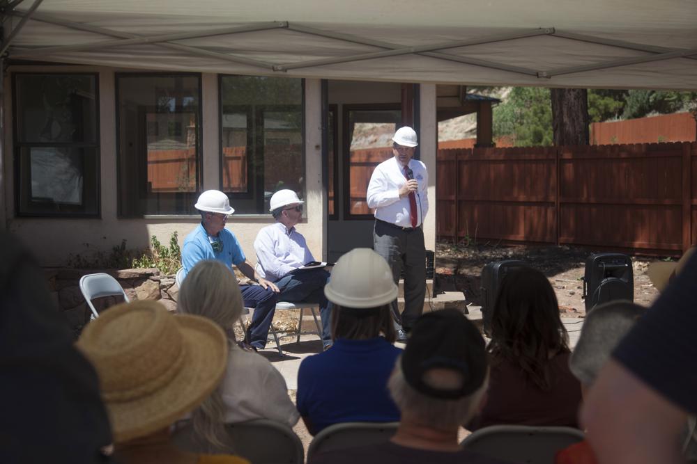Community members commemorate the start of construction on what will be the Springdale History and Visitor Center Thursday, May 6, 2021, in Springdale, Utah. A former motel built with wood from Zion National Park will be rebuilt as the Springdale History Center, a museum dedicated to the legacy of the national park’s gateway town.