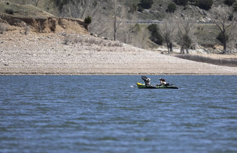 People kayak in Echo Reservoir north of Coalville on Thursday, May 6, 2021.