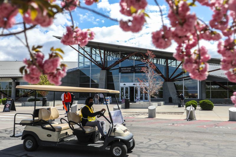 Utahns walk into the Mountain America Expo Center in
Sandy for a COVID-19 vaccine on Monday, May 3, 2021. The site
previously had difficulty securing doses of a COVID-19 vaccine but
now has the ability to do walk-up vaccinations 10 a.m. to 2 p.m.
Monday-Saturday instead of only by appointment.