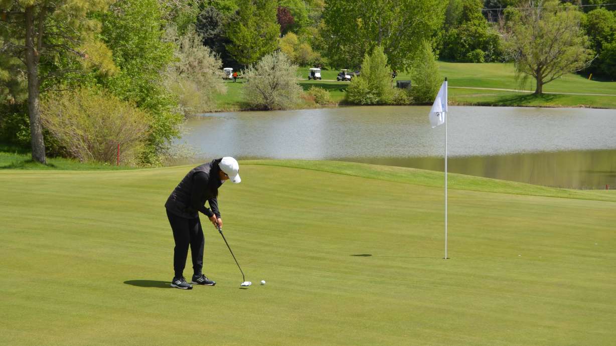 Timpview's Sunbin Seo putts during the first day of the Class 5A state golf meet, Monday, May 10, 2021 at Spanish Oaks in Spanish Fork.