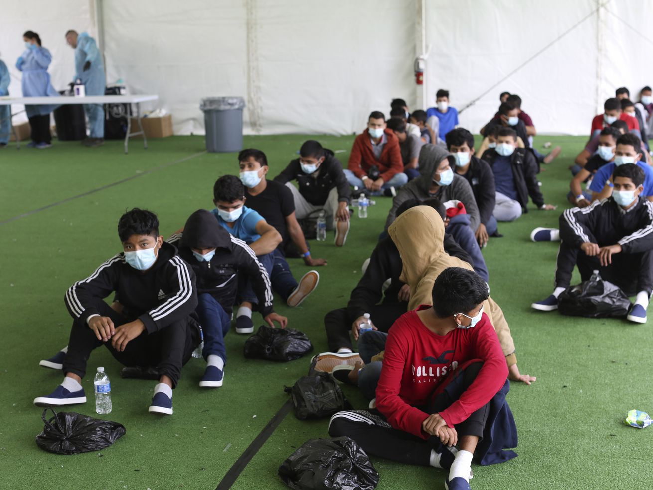 Young migrants wait to be tested for COVID-19 at the
Donna Department of Homeland Security holding facility, the main
detention center for unaccompanied children in the Rio Grande
Valley, in Donna, Texas, on March 30, 2021. Gov. Spencer Cox on
Tuesday, May 11, 2021, joined 18 other Republican governors in
signing a joint letter sent to President Joe Biden on Tuesday
requesting control of the crisis at the border.