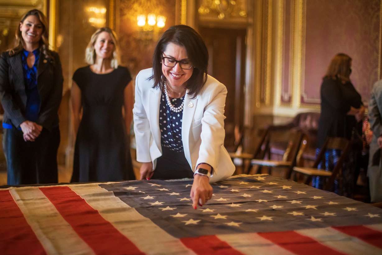 Lt. Gov. Deidre Henderson points to the 45th star of the original 45-star flag made in 1896 after Utah became a state.